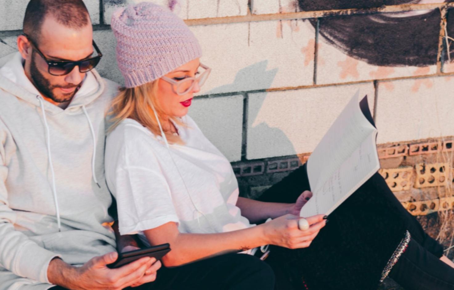 Couple discussing finances together at kitchen table